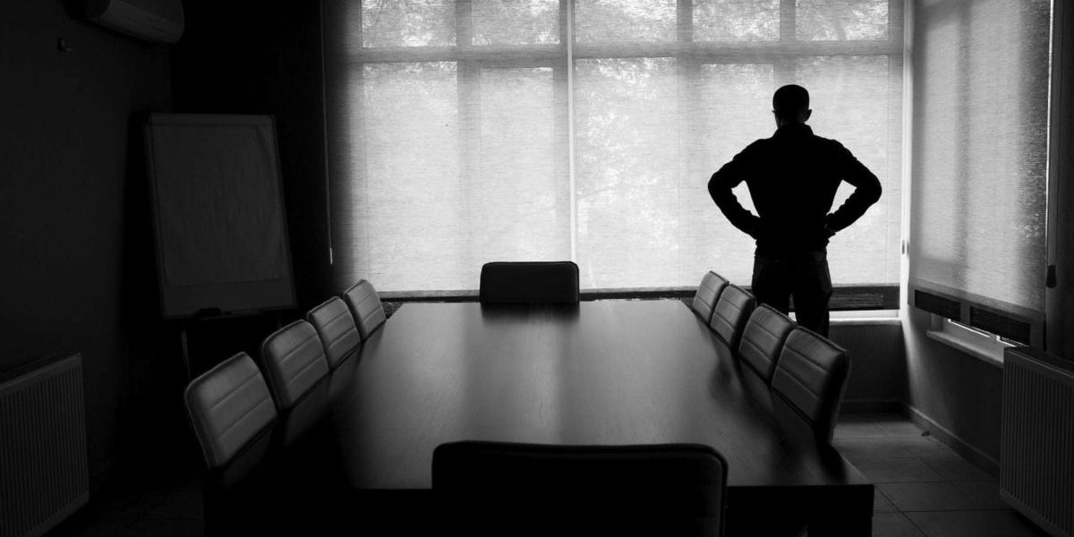 bankruptcy-man-alone-conference-room Man influenced by bankruptcy