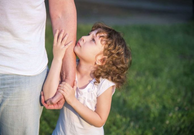 child-hugging-parents-arm Child Custody Lawyer